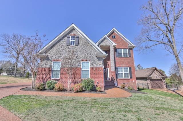 127 Waters Hill Cir, Lebanon, TN 37087 - traditional-style home with brick siding, fence, and a front yard