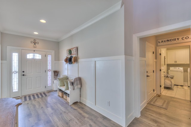 127 Waters Hill Cir, Lebanon, TN 37087 - foyer featuring crown molding, wainscoting, wood finished floors, and washer / clothes dryer
