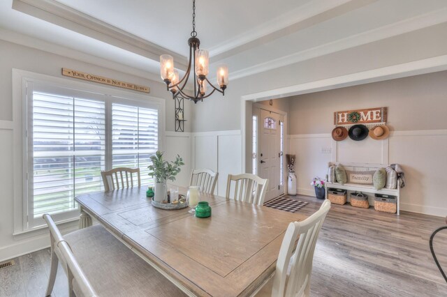 127 Waters Hill Cir, Lebanon, TN 37087 - dining space featuring a healthy amount of sunlight, wood finished floors, a chandelier, and wainscoting
