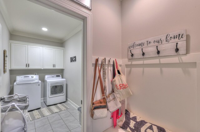 127 Waters Hill Cir, Lebanon, TN 37087 - laundry area featuring independent washer and dryer, ornamental molding, baseboards, light tile patterned flooring, and cabinet space