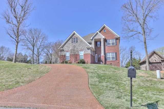 127 Waters Hill Cir, Lebanon, TN 37087 - view of front of house featuring a front yard, stone siding, and brick siding