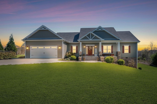 craftsman house with a front lawn, driveway, an attached garage, and roof with shingles