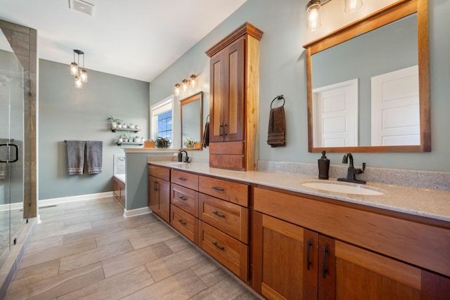 full bathroom featuring a sink, a stall shower, visible vents, double vanity, and a bath