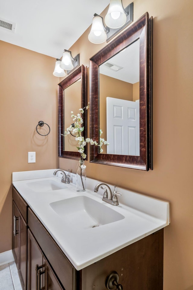 bathroom featuring visible vents and vanity