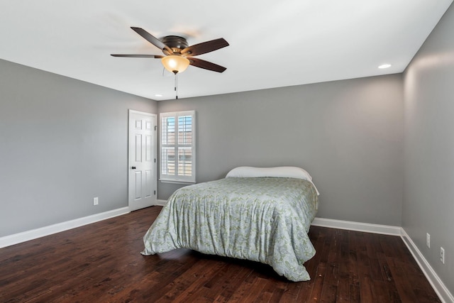 bedroom featuring baseboards, a ceiling fan, and wood finished floors
