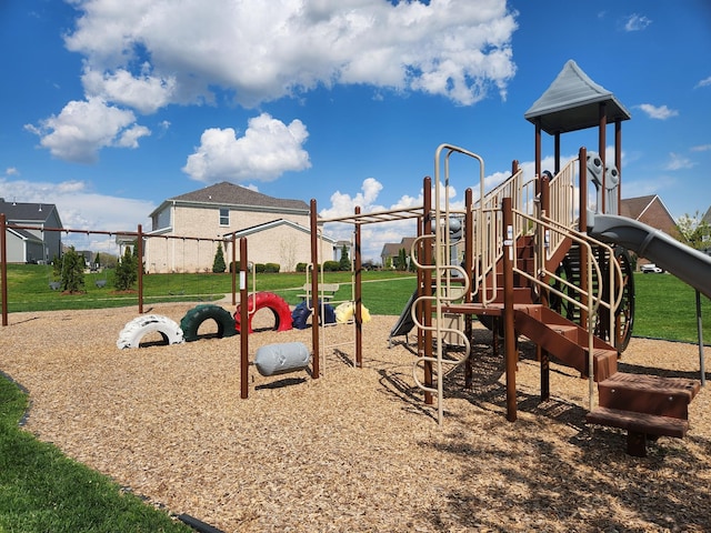 community jungle gym with a lawn