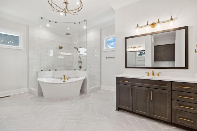 full bath featuring crown molding, a walk in shower, vanity, a soaking tub, and baseboards