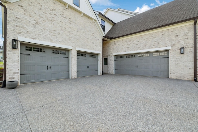 garage with concrete driveway