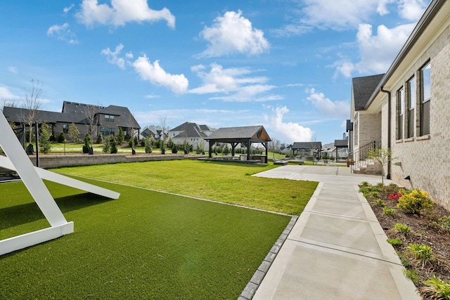 view of yard with a gazebo and a residential view