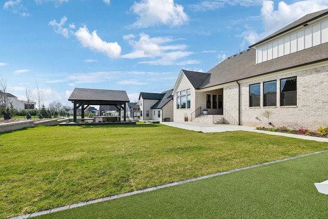 view of yard featuring a gazebo and a patio