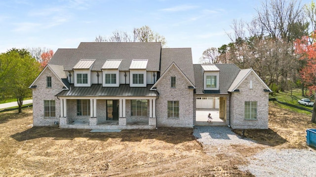 8115 Devens Dr, Brentwood, TN 37027 - view of front of house featuring covered porch, a standing seam roof, and metal roof