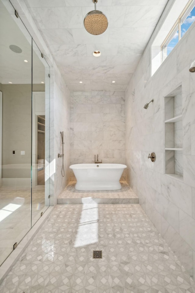 8115 Devens Dr, Brentwood, TN 37027 - bathroom featuring a soaking tub and tiled shower