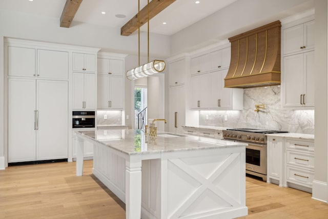 8115 Devens Dr, Brentwood, TN 37027 - kitchen with beamed ceiling, light wood finished floors, a sink, premium appliances, and custom range hood