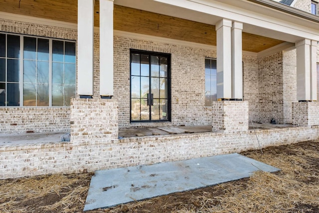 8115 Devens Dr, Brentwood, TN 37027 - view of property exterior featuring covered porch and brick siding