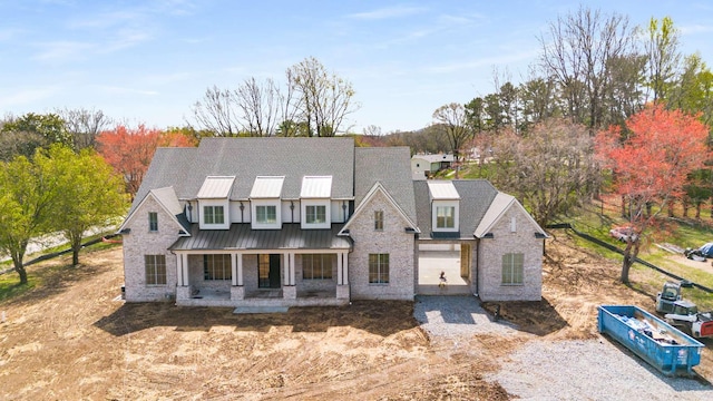 8115 Devens Dr, Brentwood, TN 37027 - modern farmhouse featuring covered porch and stone siding