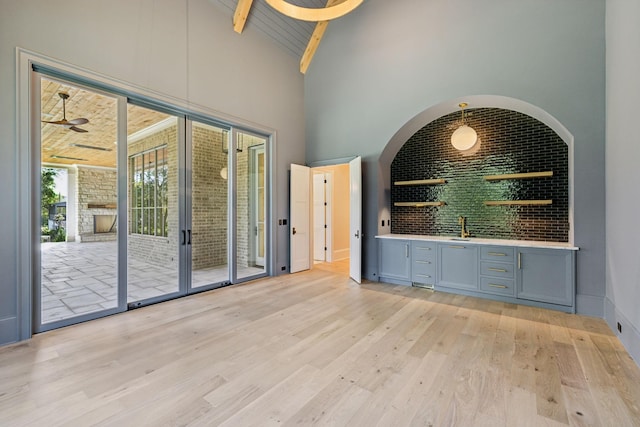 8115 Devens Dr, Brentwood, TN 37027 - spare room with high vaulted ceiling, wood ceiling, beamed ceiling, light wood-style flooring, and indoor wet bar