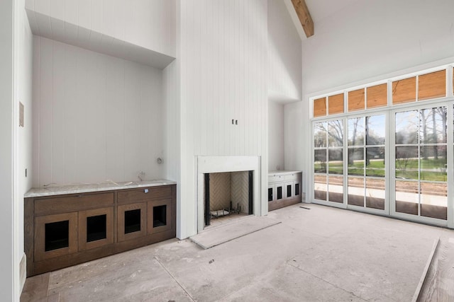 8115 Devens Dr, Brentwood, TN 37027 - unfurnished living room featuring a high ceiling and beam ceiling