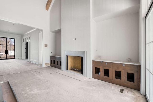 8115 Devens Dr, Brentwood, TN 37027 - unfurnished living room with a towering ceiling and a fireplace