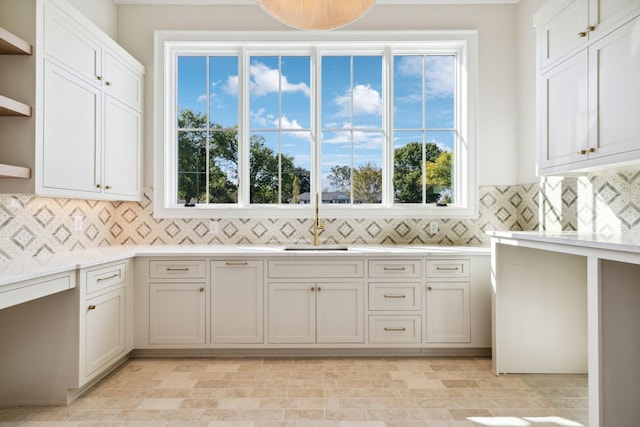 8115 Devens Dr, Brentwood, TN 37027 - kitchen with light countertops, tasteful backsplash, a sink, and open shelves