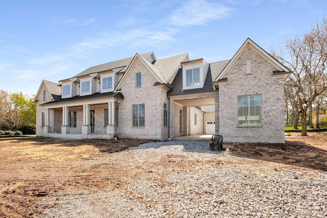 8115 Devens Dr, Brentwood, TN 37027 - view of front facade with covered porch and brick siding