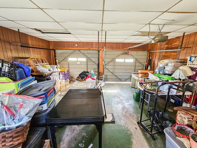 101 Church St, Wartrace, TN 37183 - garage with wooden walls and a garage door opener