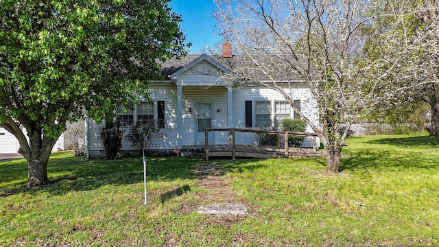 101 Church St, Wartrace, TN 37183 - view of front facade featuring a chimney and a front yard