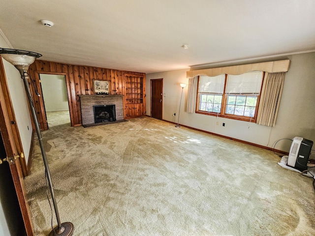 101 Church St, Wartrace, TN 37183 - unfurnished living room with crown molding, a fireplace, baseboards, and carpet
