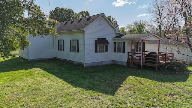 101 Church St, Wartrace, TN 37183 - back of property with a yard, a deck, and roof with shingles