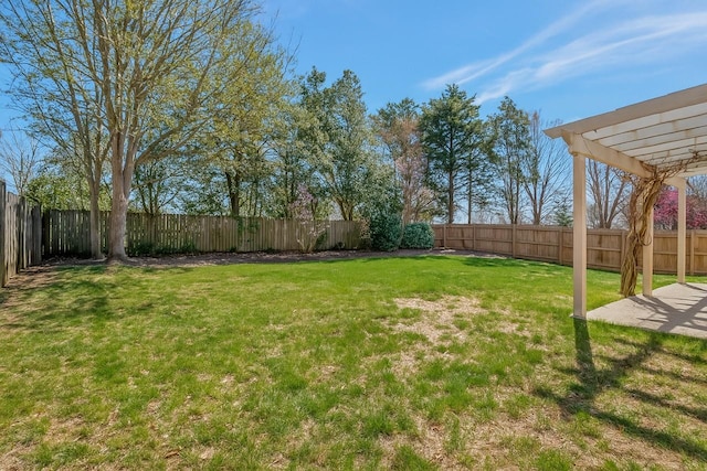 view of yard with a pergola, a fenced backyard, and a patio