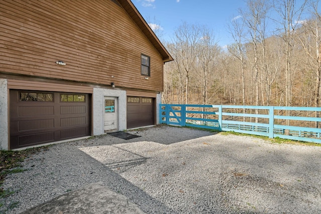 3755 Bear Hollow Rd, Joelton, TN 37080 - garage featuring gravel driveway and fence