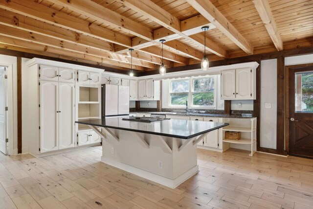 3755 Bear Hollow Rd, Joelton, TN 37080 - kitchen with white cabinetry, a sink, freestanding refrigerator, and open shelves