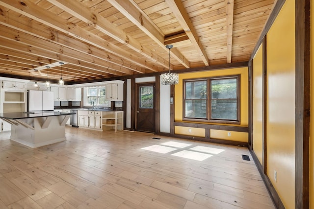 3755 Bear Hollow Rd, Joelton, TN 37080 - kitchen featuring open shelves, light wood finished floors, dishwasher, visible vents, and dark countertops