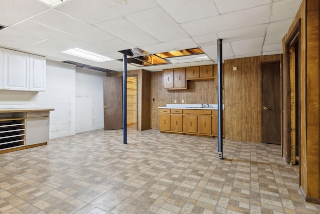 3755 Bear Hollow Rd, Joelton, TN 37080 - finished basement featuring wooden walls, a sink, and a drop ceiling