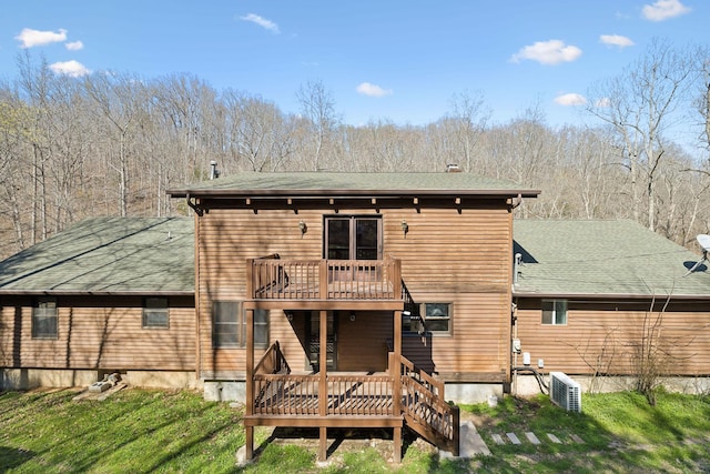 3755 Bear Hollow Rd, Joelton, TN 37080 - back of house with a lawn, a shingled roof, and a wooden deck