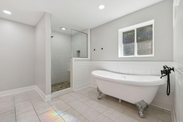 3755 Bear Hollow Rd, Joelton, TN 37080 - bathroom with recessed lighting, a walk in shower, a soaking tub, and wainscoting