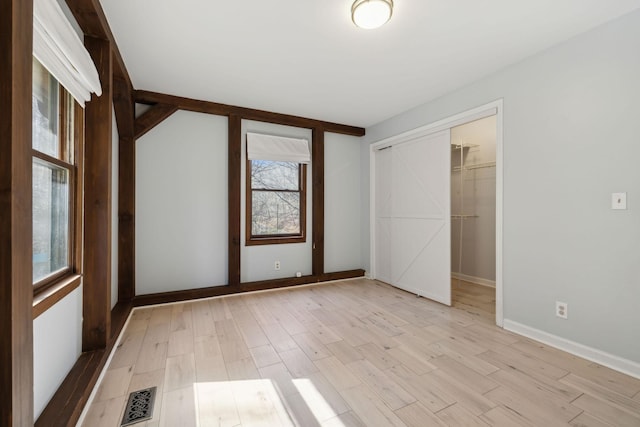 3755 Bear Hollow Rd, Joelton, TN 37080 - unfurnished bedroom featuring a closet, baseboards, visible vents, and light wood-type flooring