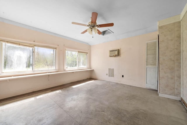 spare room with concrete flooring, a wall mounted air conditioner, baseboards, and ceiling fan