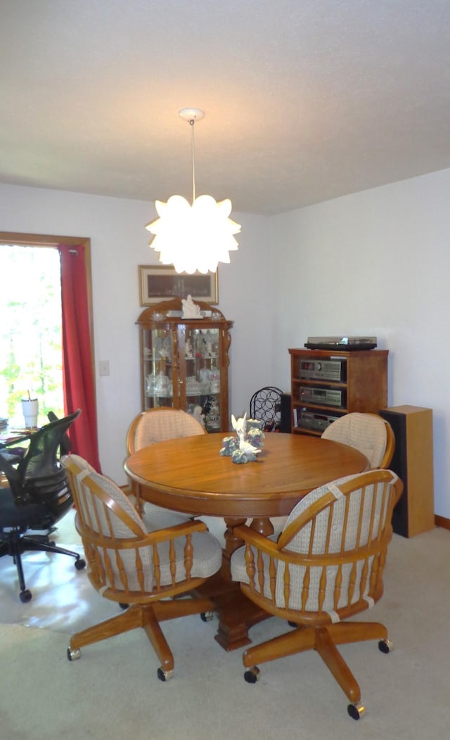 dining room with a notable chandelier