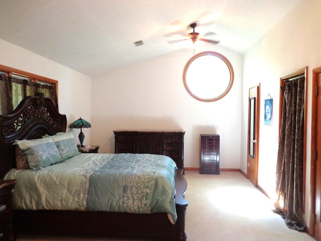 bedroom with vaulted ceiling, a ceiling fan, baseboards, light colored carpet, and visible vents