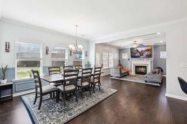 7403 Hemen Way, Fairview, TN 37062 - dining room featuring a wealth of natural light, a lit fireplace, ornamental molding, and dark wood-style flooring