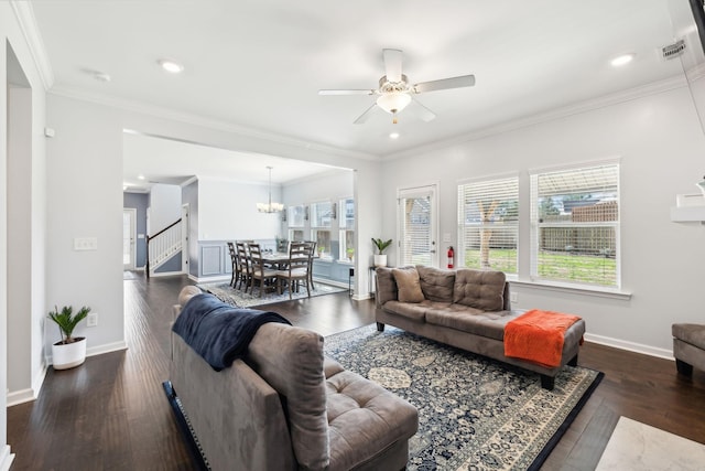 7403 Hemen Way, Fairview, TN 37062 - living room with ornamental molding, ceiling fan with notable chandelier, baseboards, and dark wood finished floors