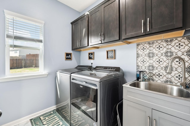 7403 Hemen Way, Fairview, TN 37062 - laundry area with baseboards, cabinet space, a sink, and washer and clothes dryer