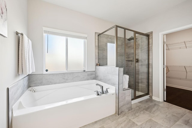7403 Hemen Way, Fairview, TN 37062 - full bathroom featuring a stall shower, a bath, and a spacious closet