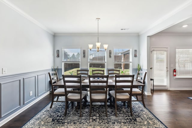 7403 Hemen Way, Fairview, TN 37062 - dining space featuring an inviting chandelier, dark wood finished floors, ornamental molding, and visible vents
