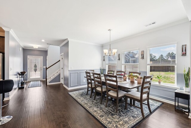 7403 Hemen Way, Fairview, TN 37062 - dining space featuring a wainscoted wall, stairs, visible vents, dark wood-type flooring, and an inviting chandelier