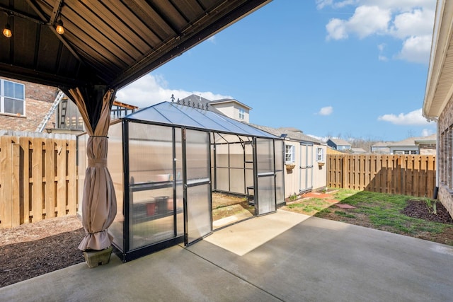 7403 Hemen Way, Fairview, TN 37062 - view of patio with a fenced backyard, an outbuilding, a greenhouse, and a residential view
