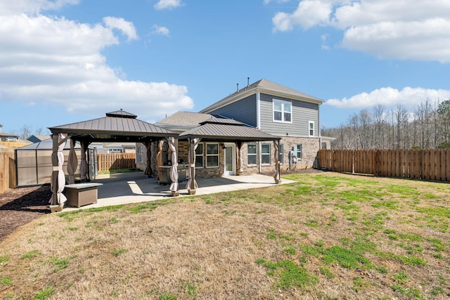 7403 Hemen Way, Fairview, TN 37062 - rear view of property featuring a patio, a fenced backyard, a gazebo, and a lawn