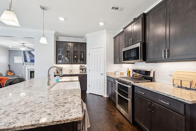 7403 Hemen Way, Fairview, TN 37062 - kitchen featuring ornamental molding, a sink, dark wood-style floors, visible vents, and appliances with stainless steel finishes