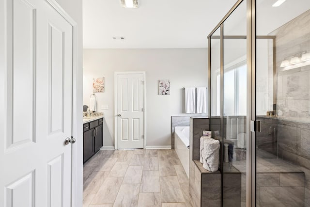 7403 Hemen Way, Fairview, TN 37062 - full bathroom featuring vanity, a stall shower, baseboards, and a garden tub