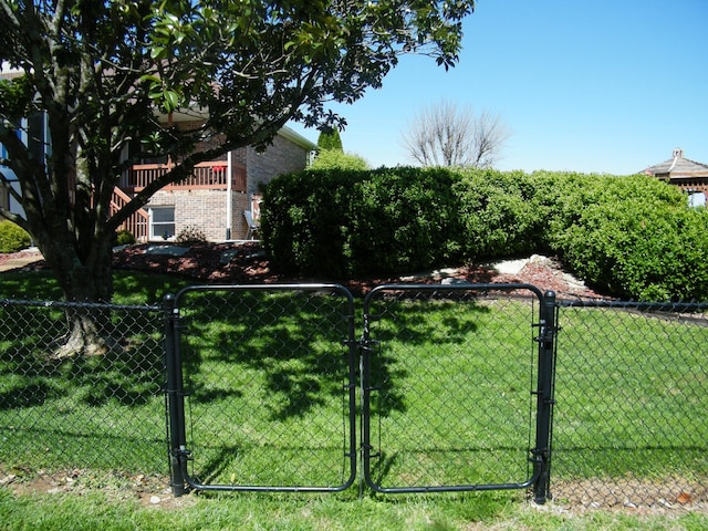 view of yard with fence and a gate